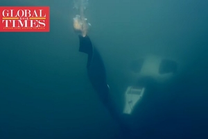 Олимпийский огонь под водой пронесли роботы